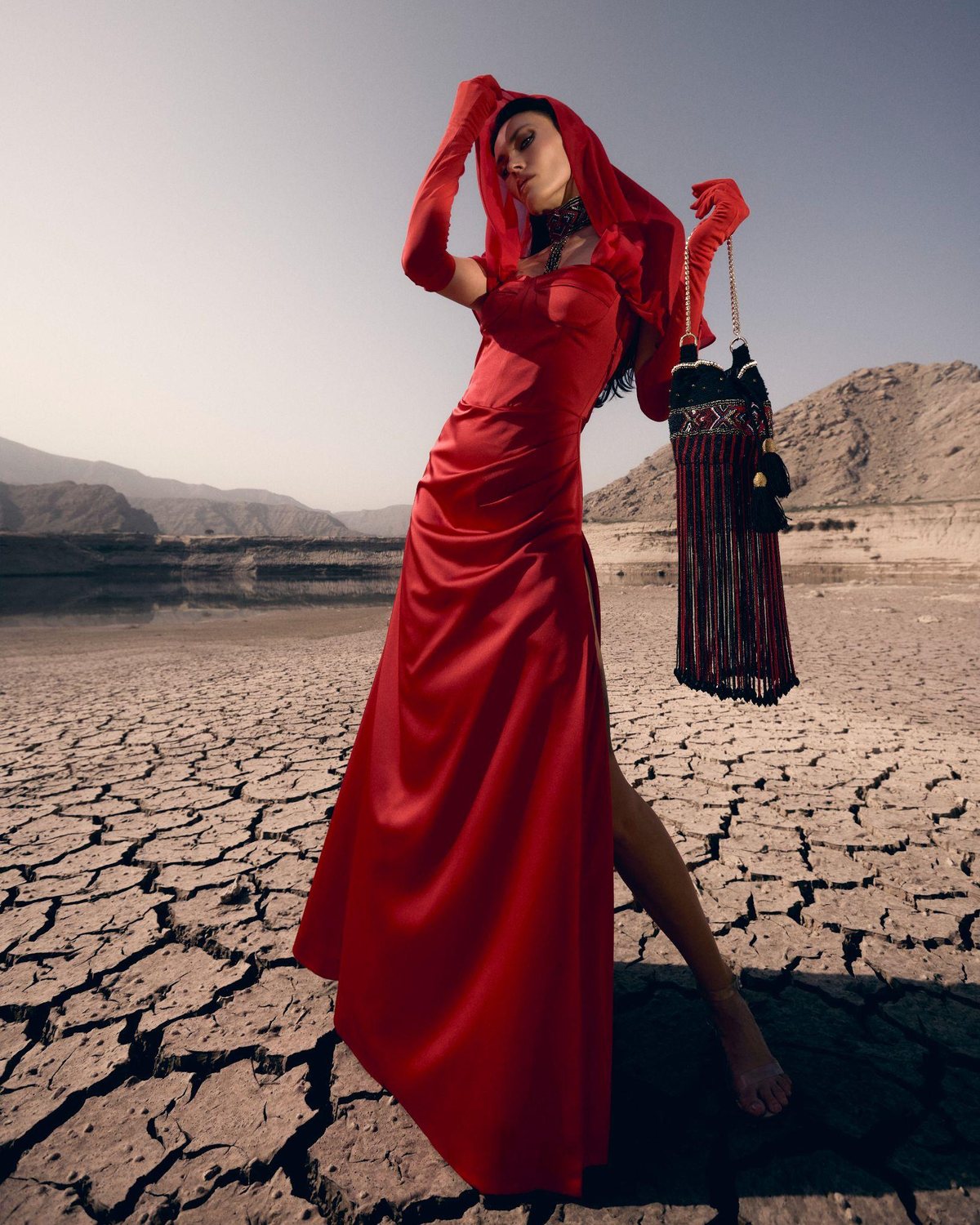 A FAIR BLVD look, a scarlet gown with a hand-beaded, tasseled bag